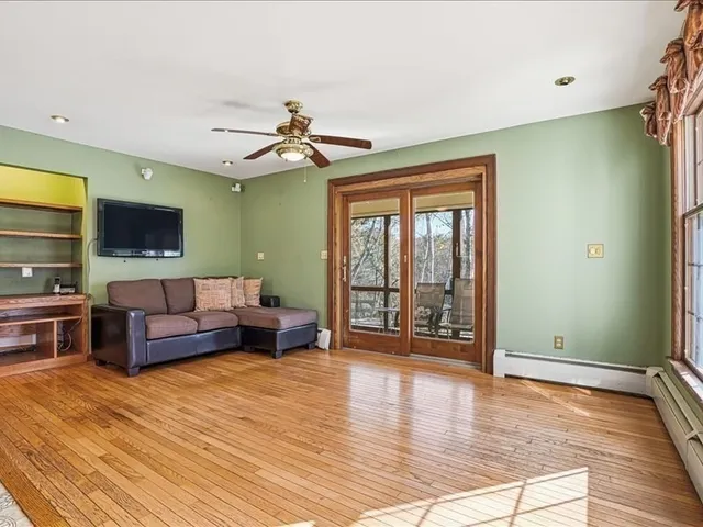 a large kitchen with kitchen island a stove a sink and dishwasher wooden cabinets with granite countertops