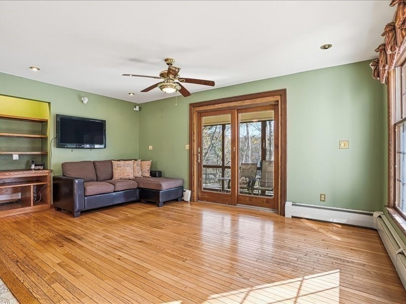 15 North Cove Road Sterling, MA 01564 - Photo 17 of 37 a living room with furniture and a flat screen tv