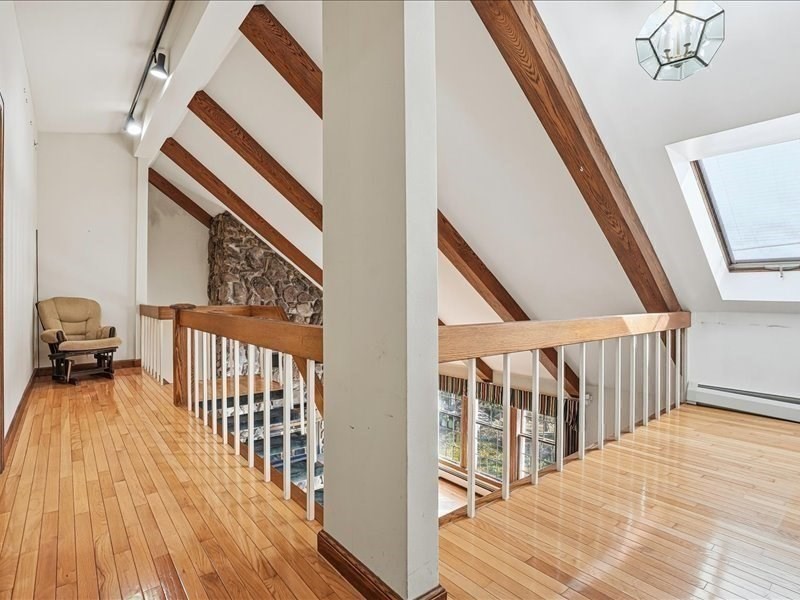 15 North Cove Road Sterling, MA 01564 - Photo 28 of 37 a view of a hallway with wooden floor and stairs