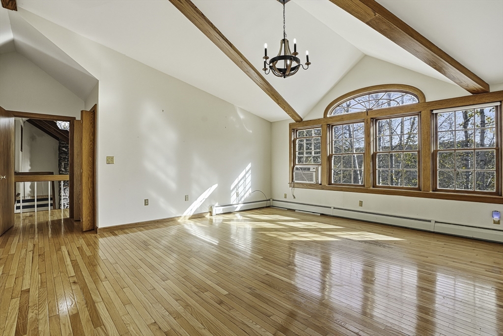 15 North Cove Road Sterling, MA 01564 - Photo 31 of 37 a view of an empty room with wooden floor and a window