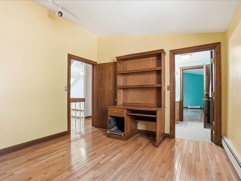 15 North Cove Road Sterling, MA 01564 - Photo 33 of 37 an empty room with wooden floor closet and windows