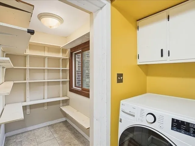 a bathroom with a granite countertop sink mirror a toilet and a mirror