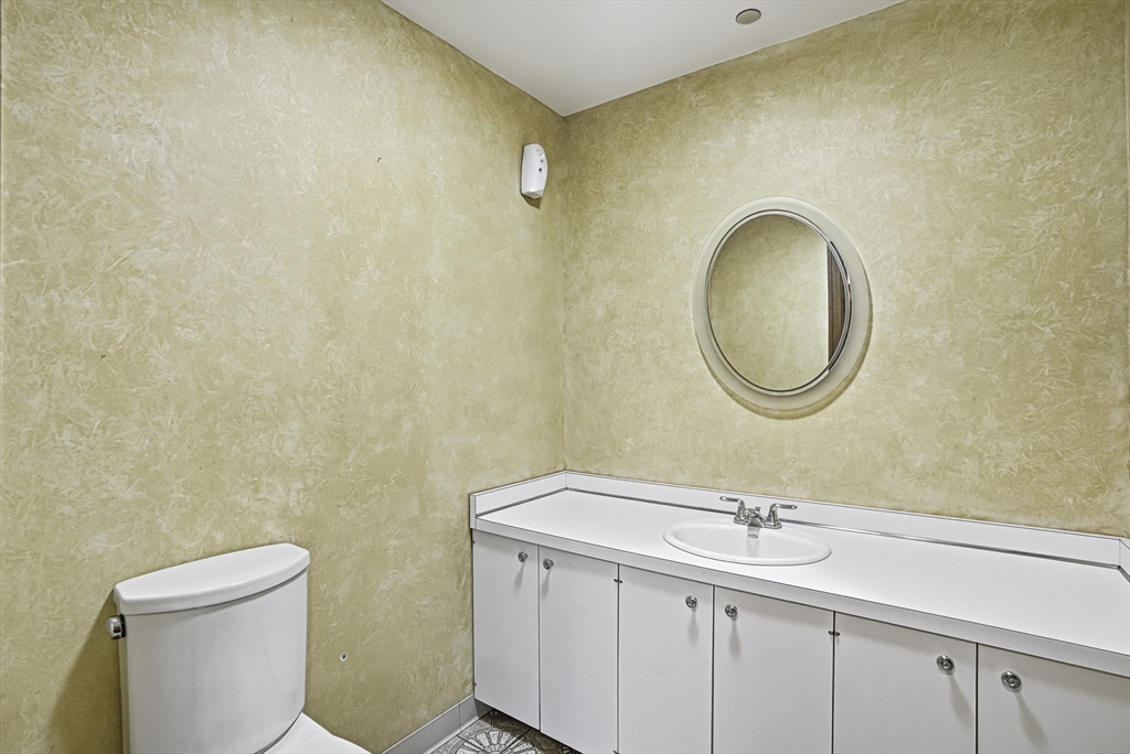 15 North Cove Road Sterling, MA 01564 - Photo 7 of 37 a bathroom with a granite countertop sink mirror a toilet and a mirror