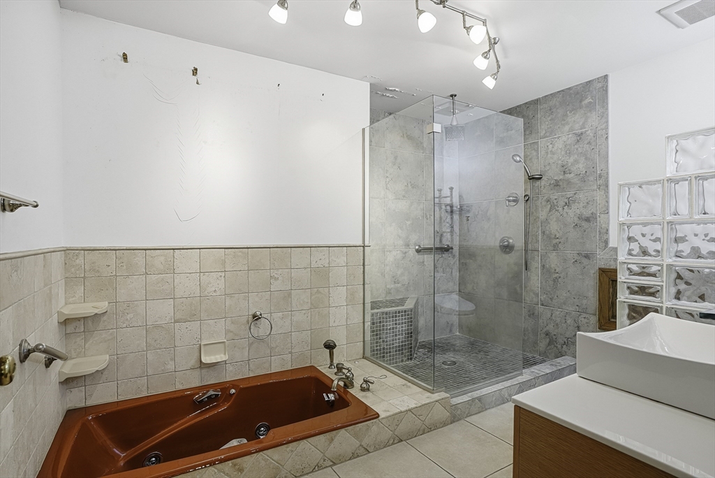 15 North Cove Road Sterling, MA 01564 - Photo 10 of 37 a bathroom with a bathtub and shower