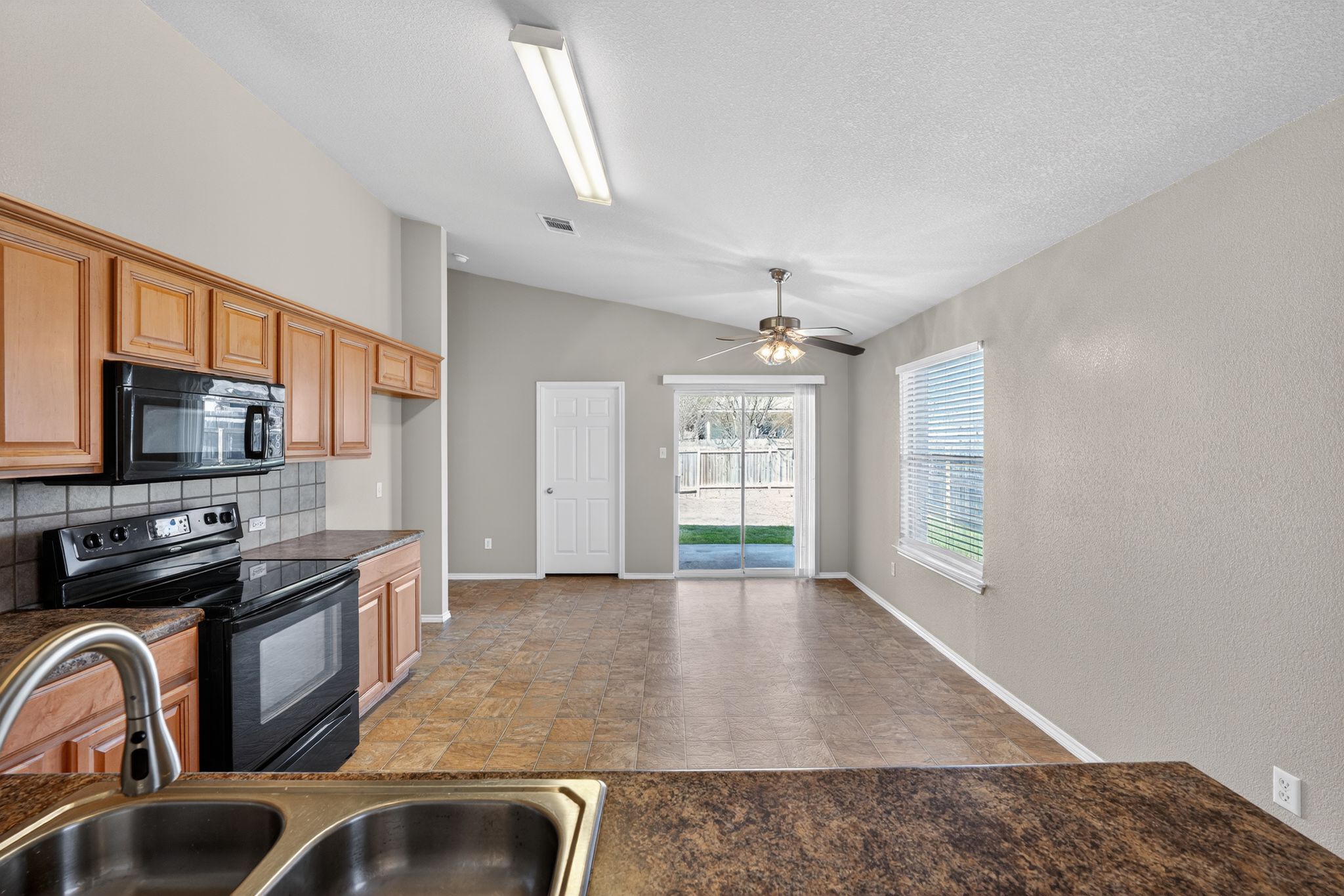 1007 Gentry Drive Leander, TX 78641 - Photo 15 of 35 a view of a kitchen with a sink and dishwasher
