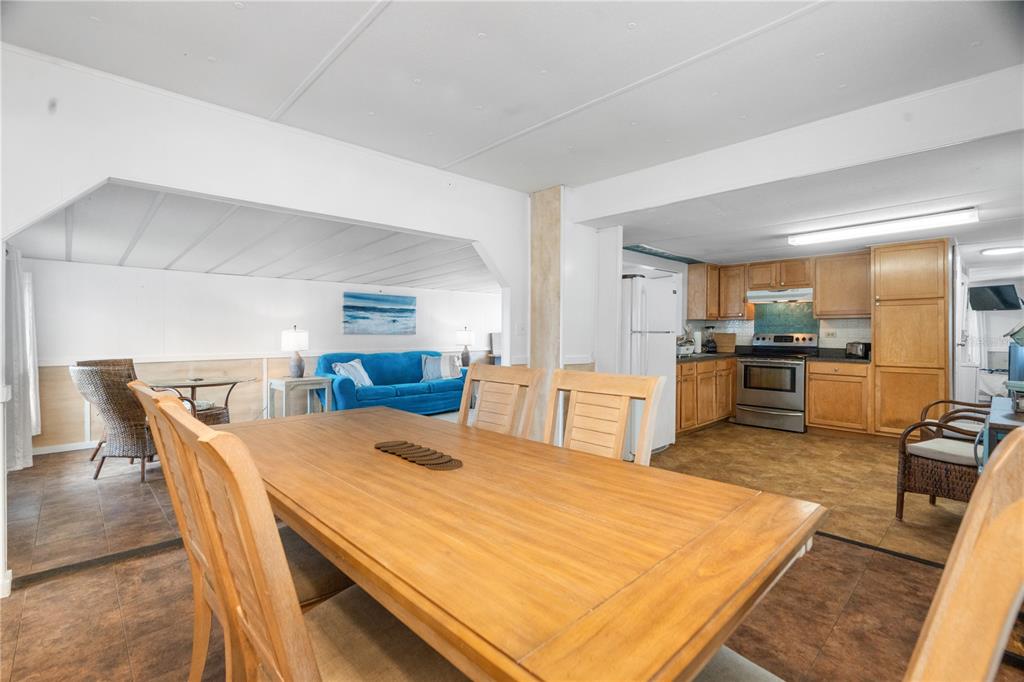 6501 Clark Street Hudson, FL 34667 - Photo 12 of 27 a large kitchen with a table and chairs