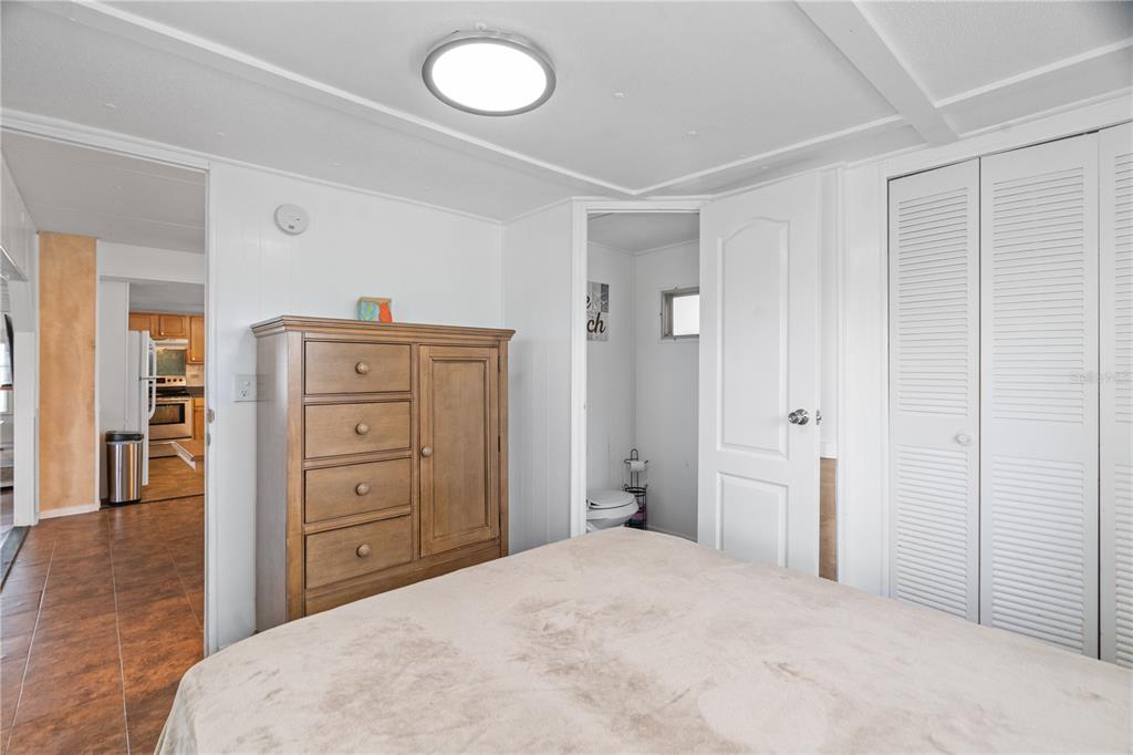 6501 Clark Street Hudson, FL 34667 - Photo 14 of 27 a bedroom with a bed and a dresser