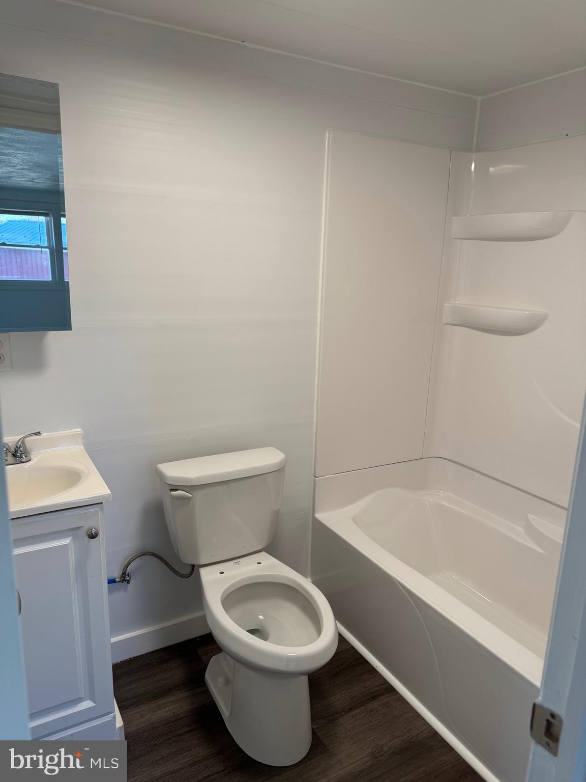 356 Keneagy Hill Road, Unit 12B Ronks, PA 17572 - Photo 5 of 5 a white toilet sitting next to a bath tub