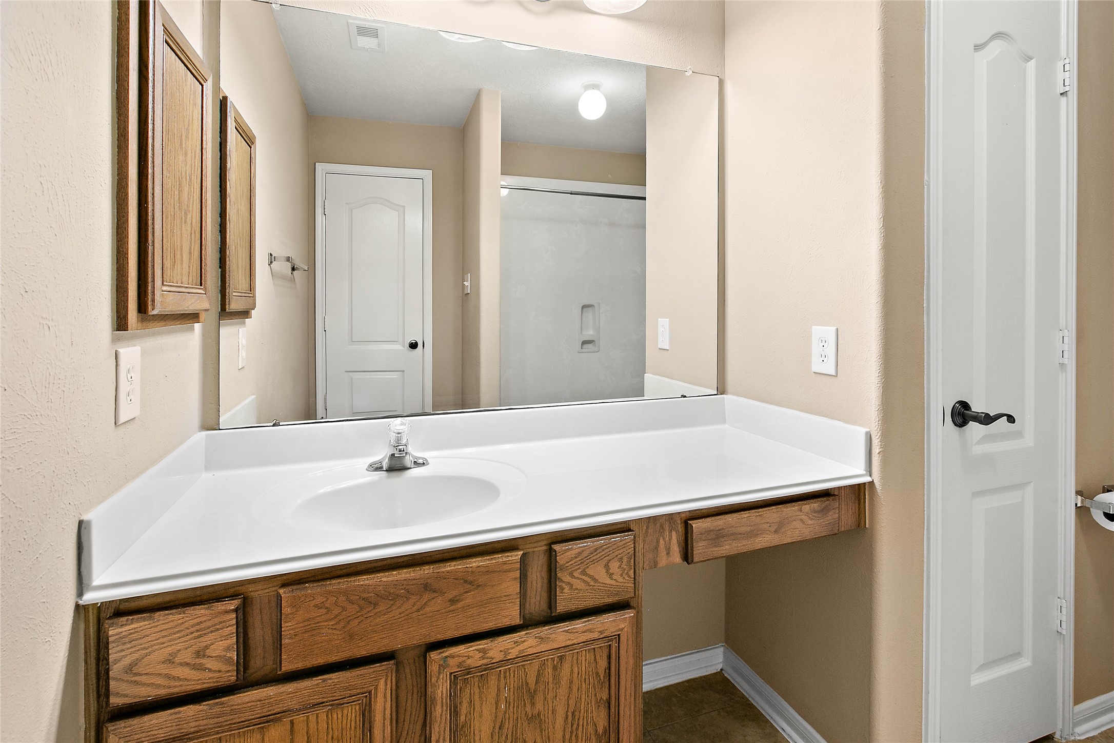 30411 Deleon Fields Drive Spring, TX 77386 - Photo 19 of 24 Functional secondary bath with convenient built-in storage.