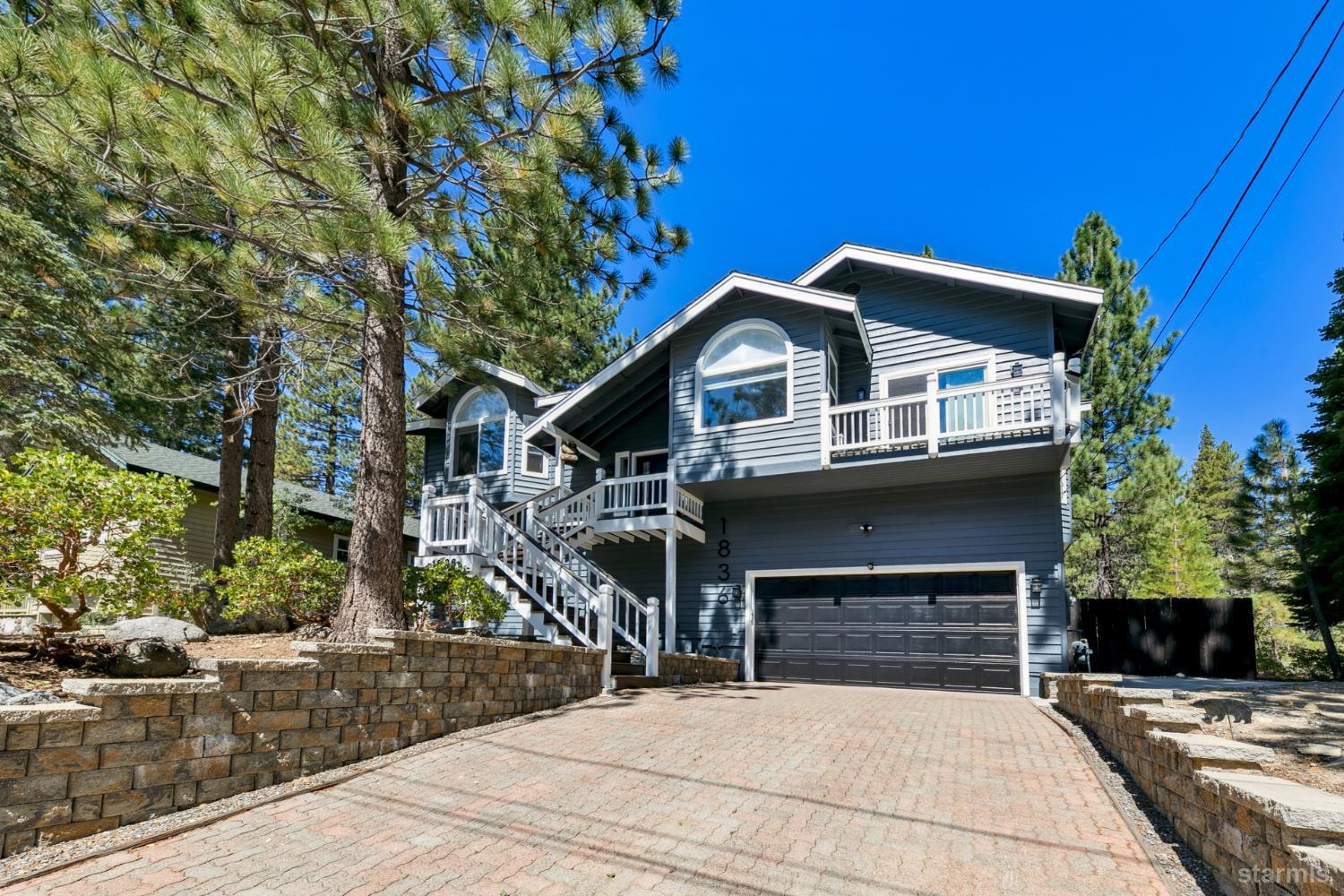 a front view of a house with yard