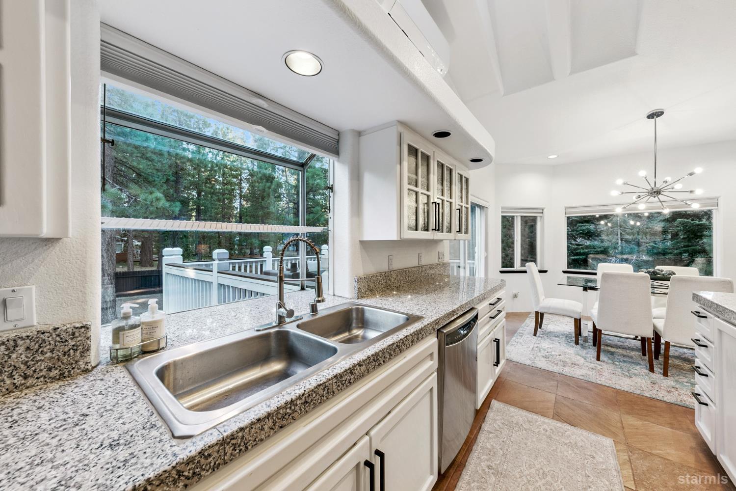 1836 Grizzly Mountain Drive South Lake Tahoe, CA 96150 - Photo 14 of 40 a kitchen with stainless steel appliances granite countertop a sink and a wooden cabinets