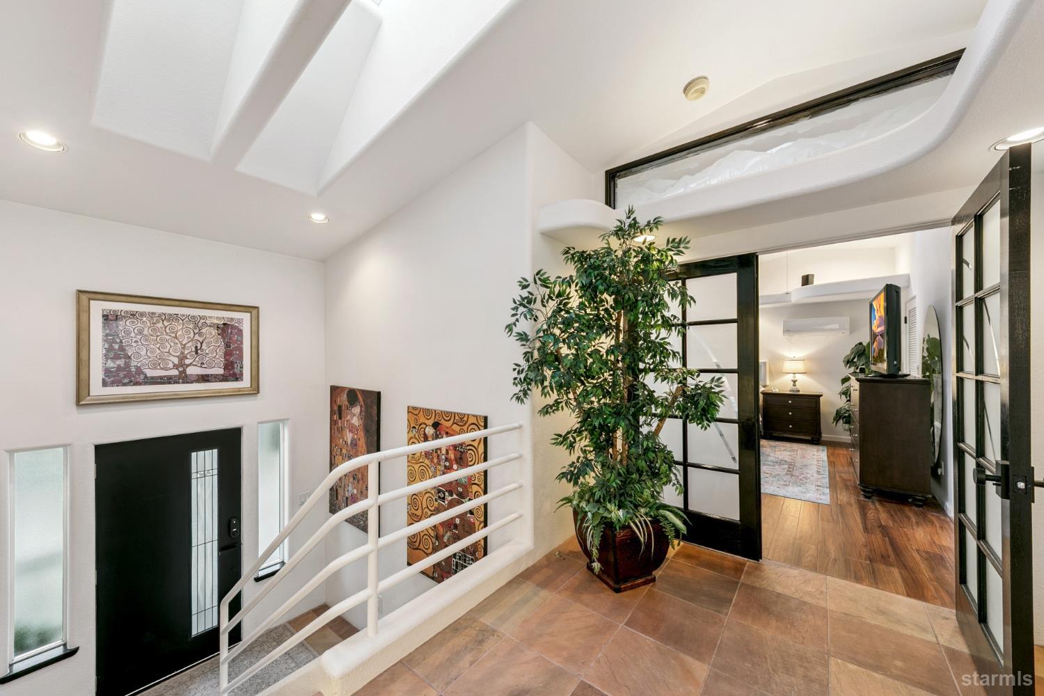 1836 Grizzly Mountain Drive South Lake Tahoe, CA 96150 - Photo 25 of 40 a view of a hallway with a potted plant