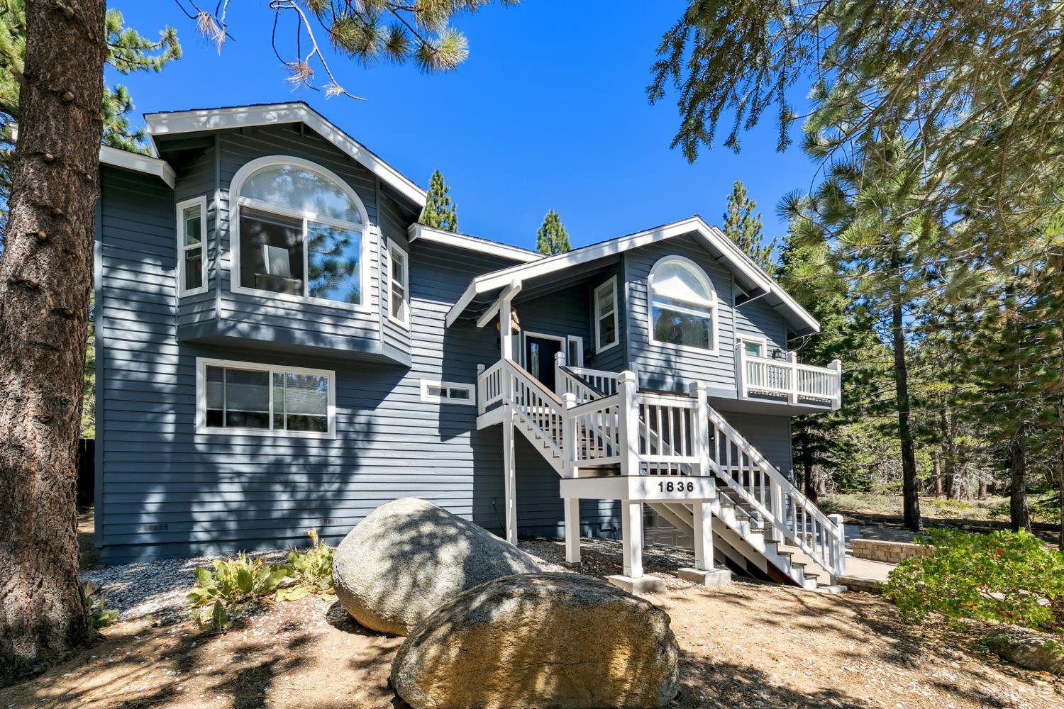 1836 Grizzly Mountain Drive South Lake Tahoe, CA 96150 - Photo 3 of 40 a front view of a house with a yard