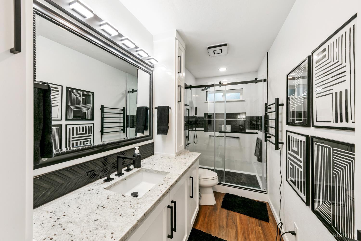 1836 Grizzly Mountain Drive South Lake Tahoe, CA 96150 - Photo 32 of 40 a bathroom with a sink double vanity granite tub and shower