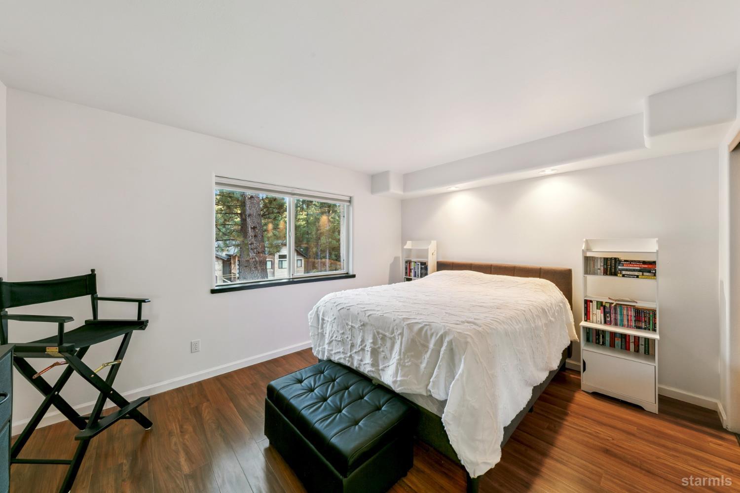 1836 Grizzly Mountain Drive South Lake Tahoe, CA 96150 - Photo 33 of 40 a bedroom with a bed and wooden floor
