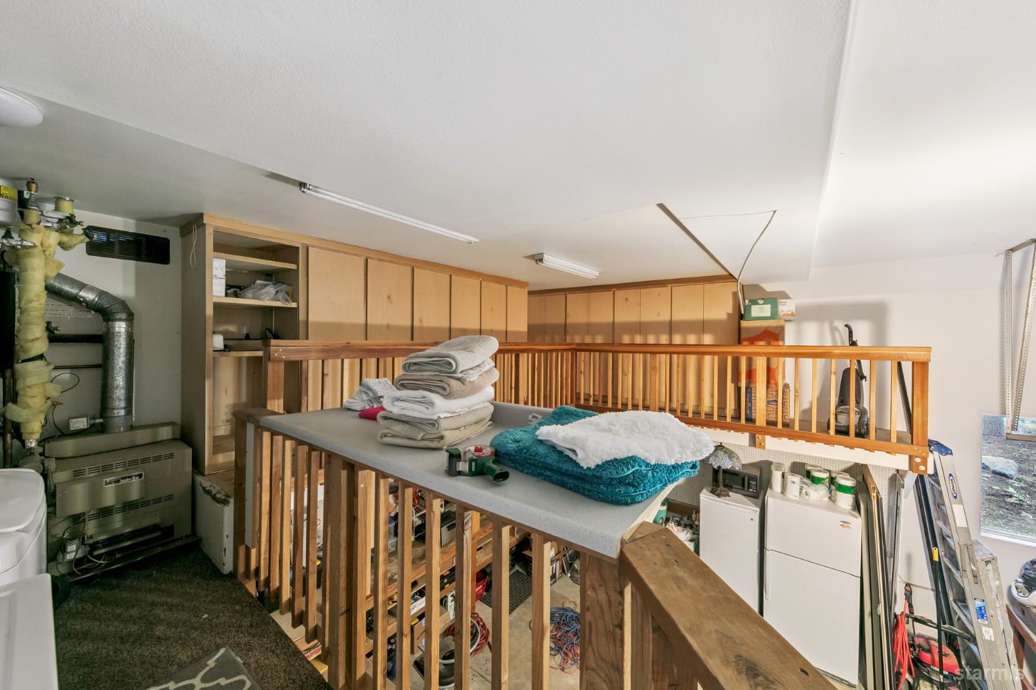 1836 Grizzly Mountain Drive South Lake Tahoe, CA 96150 - Photo 35 of 40 a view of a livingroom with furniture hardwood floor and staircase