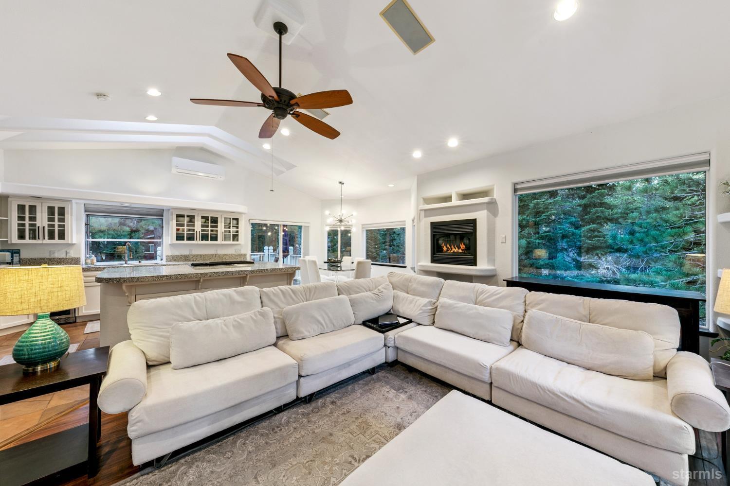 1836 Grizzly Mountain Drive South Lake Tahoe, CA 96150 - Photo 7 of 40 a living room with furniture and a large window