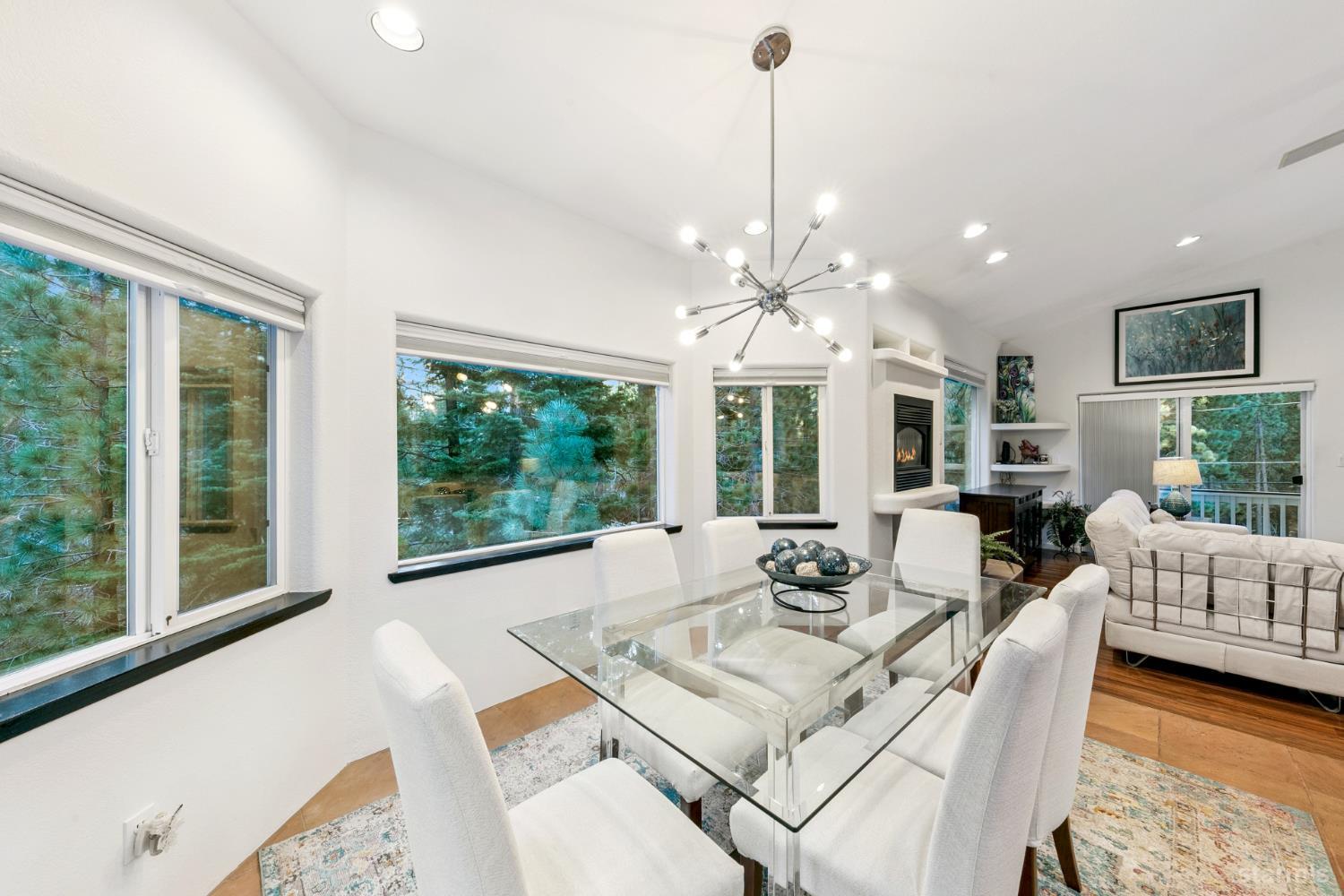 1836 Grizzly Mountain Drive South Lake Tahoe, CA 96150 - Photo 9 of 40 a living room with furniture and a chandelier