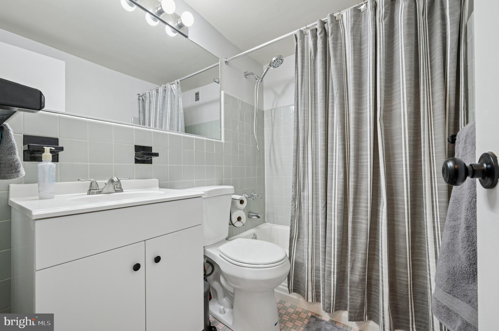 2101 Chestnut Street, Unit 1107 Philadelphia, PA 19103 - Photo 13 of 19 a bathroom with a sink a toilet and shower