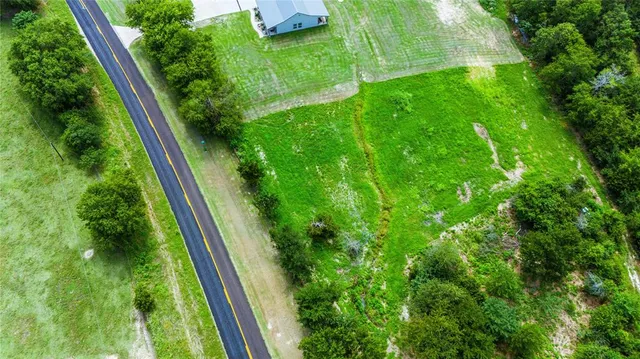 a sign that is sitting in front of a house