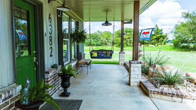 a aerial view of a house with swimming pool and garden