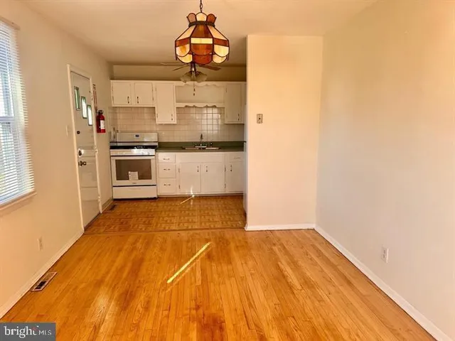 a bathroom with a sink and a refrigerator