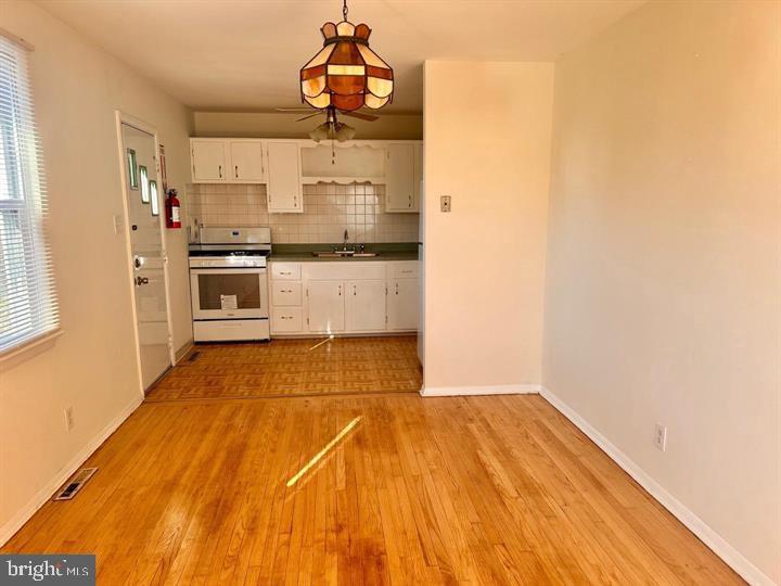 620 Filmore Street Riverside, NJ 08075 - Photo 4 of 8 a bathroom with a sink and a refrigerator