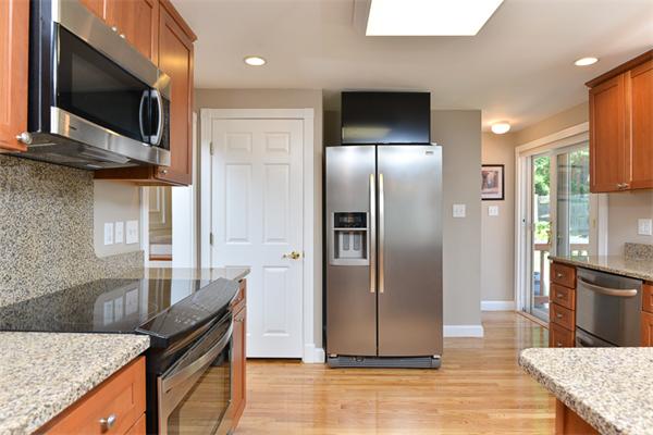 140 Governors Road Quincy, MA 02169 - Photo 11 of 24 a kitchen with stainless steel appliances granite countertop a refrigerator a stove and a sink
