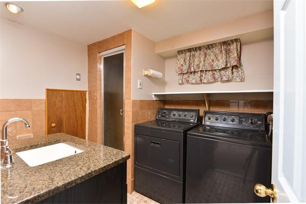 140 Governors Road Quincy, MA 02169 - Photo 19 of 24 a kitchen with granite countertop a stove and cabinets