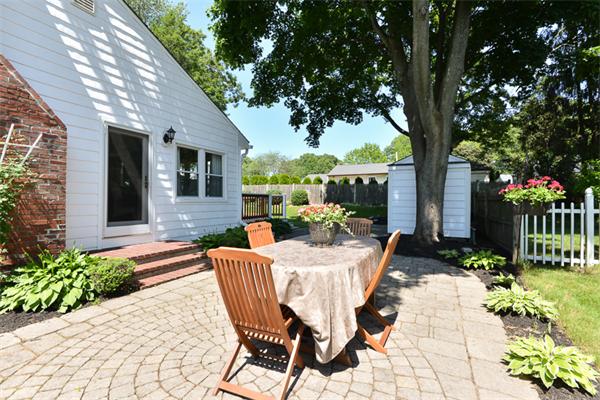 140 Governors Road Quincy, MA 02169 - Photo 20 of 24 a view of a patio with table and chairs potted plants and large tree