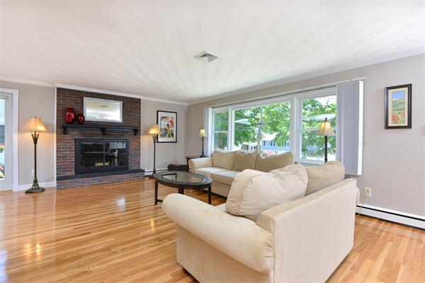 140 Governors Road Quincy, MA 02169 - Photo 4 of 24 a living room with furniture and a fireplace