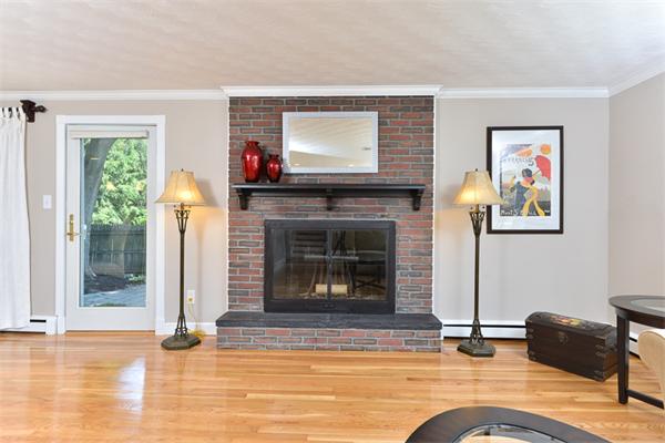 140 Governors Road Quincy, MA 02169 - Photo 5 of 24 a living room with furniture and a fireplace