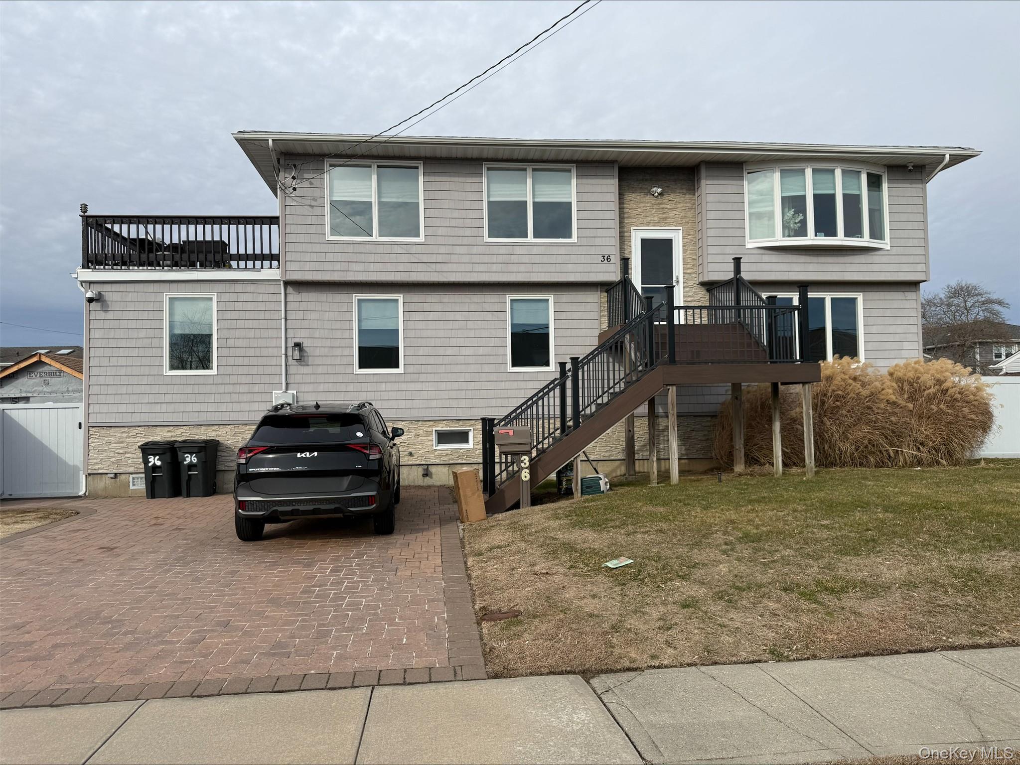 36 West Saltaire Road Lindenhurst, NY 11757 - Photo 1 of 1 a car parked in front of a house