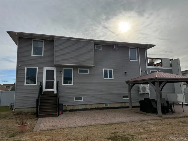 a front view of house with stairs