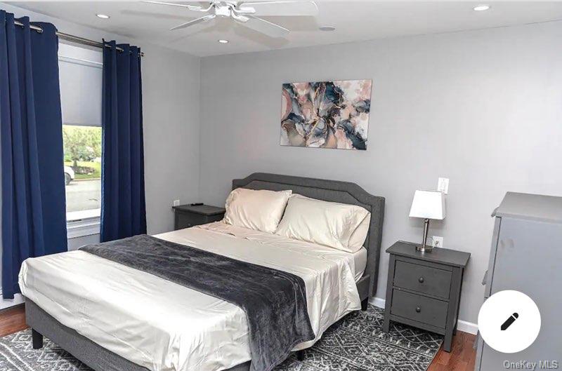 36 West Saltaire Road Lindenhurst, NY 11757 - Photo 4 of 8 a spacious bedroom with a bed and a window