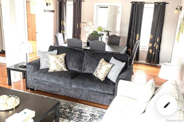 36 West Saltaire Road Lindenhurst, NY 11757 - Photo 7 of 8 a living room with furniture and a large window