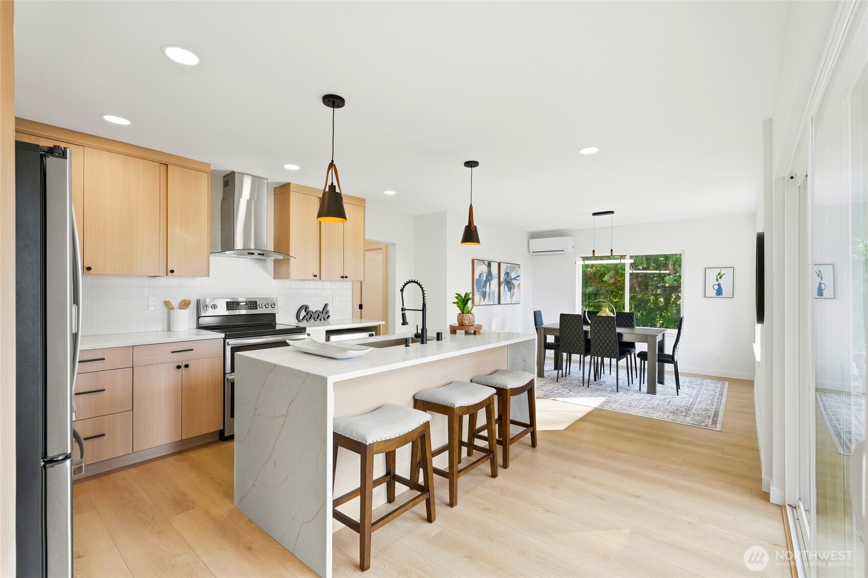 16126 Tiger Mountain Road Southeast Issaquah, WA 98027 - Photo 11 of 38 a kitchen with appliances a sink a counter top space and a center island