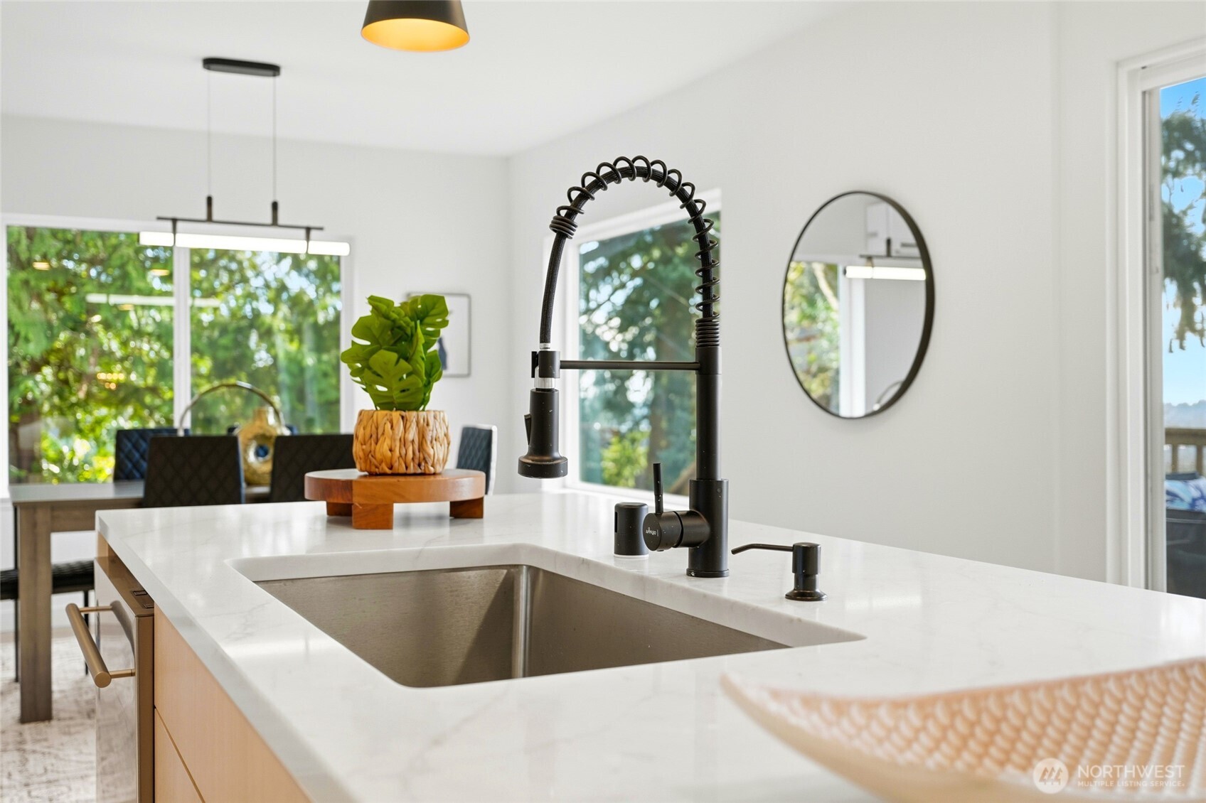 16126 Tiger Mountain Road Southeast Issaquah, WA 98027 - Photo 16 of 38 a kitchen with a table chairs and a window
