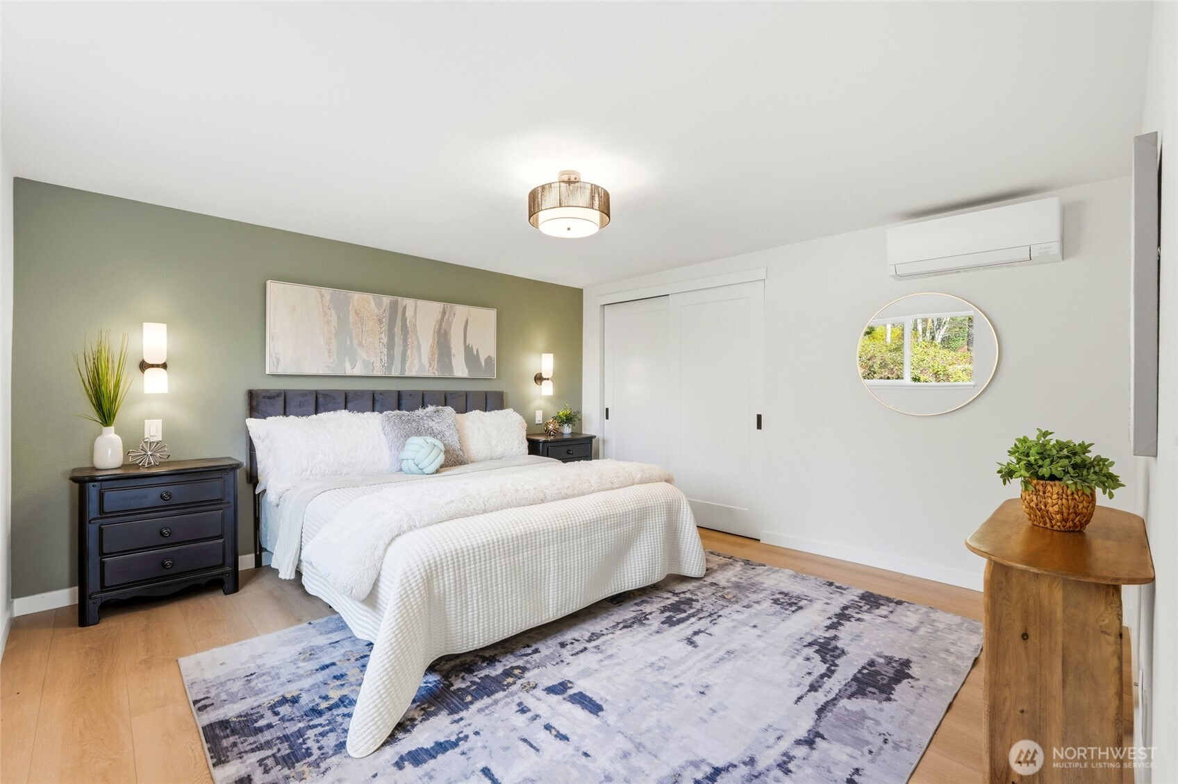 16126 Tiger Mountain Road Southeast Issaquah, WA 98027 - Photo 22 of 38 a bedroom with a bed and a lamp on dresser