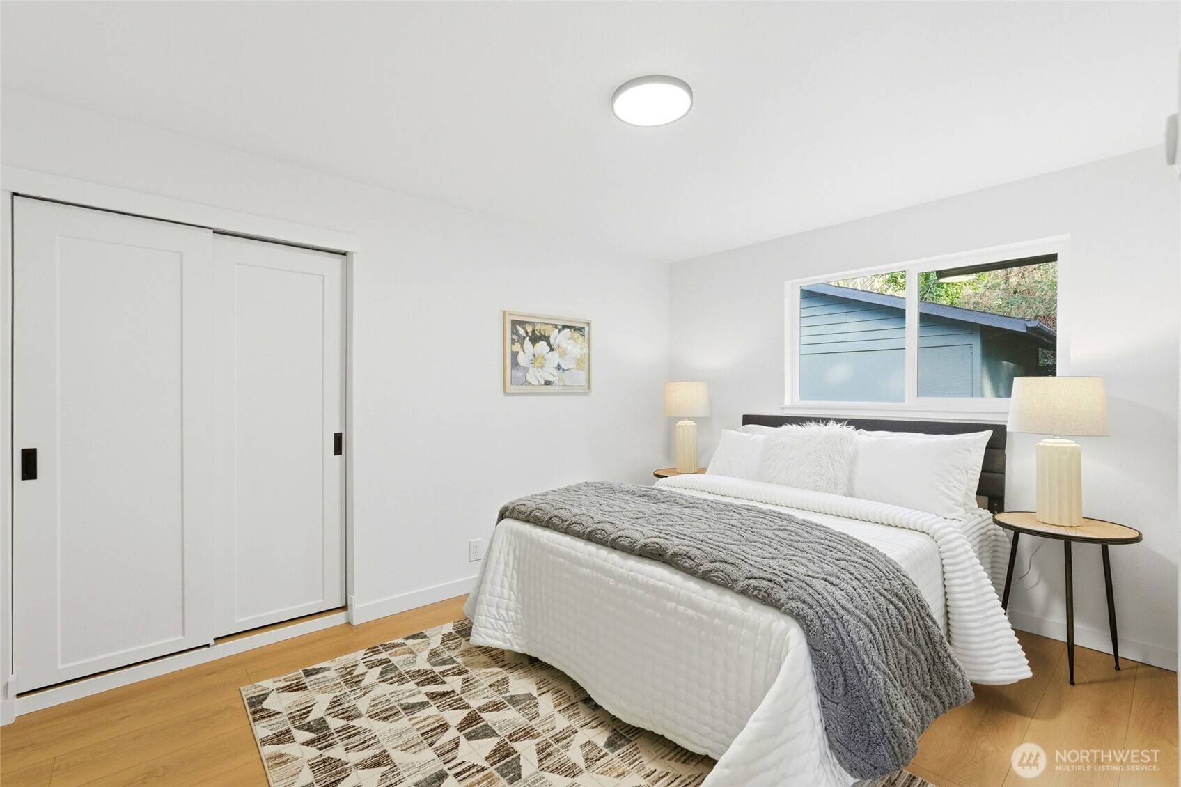 16126 Tiger Mountain Road Southeast Issaquah, WA 98027 - Photo 24 of 38 a bed room with a bed and a window