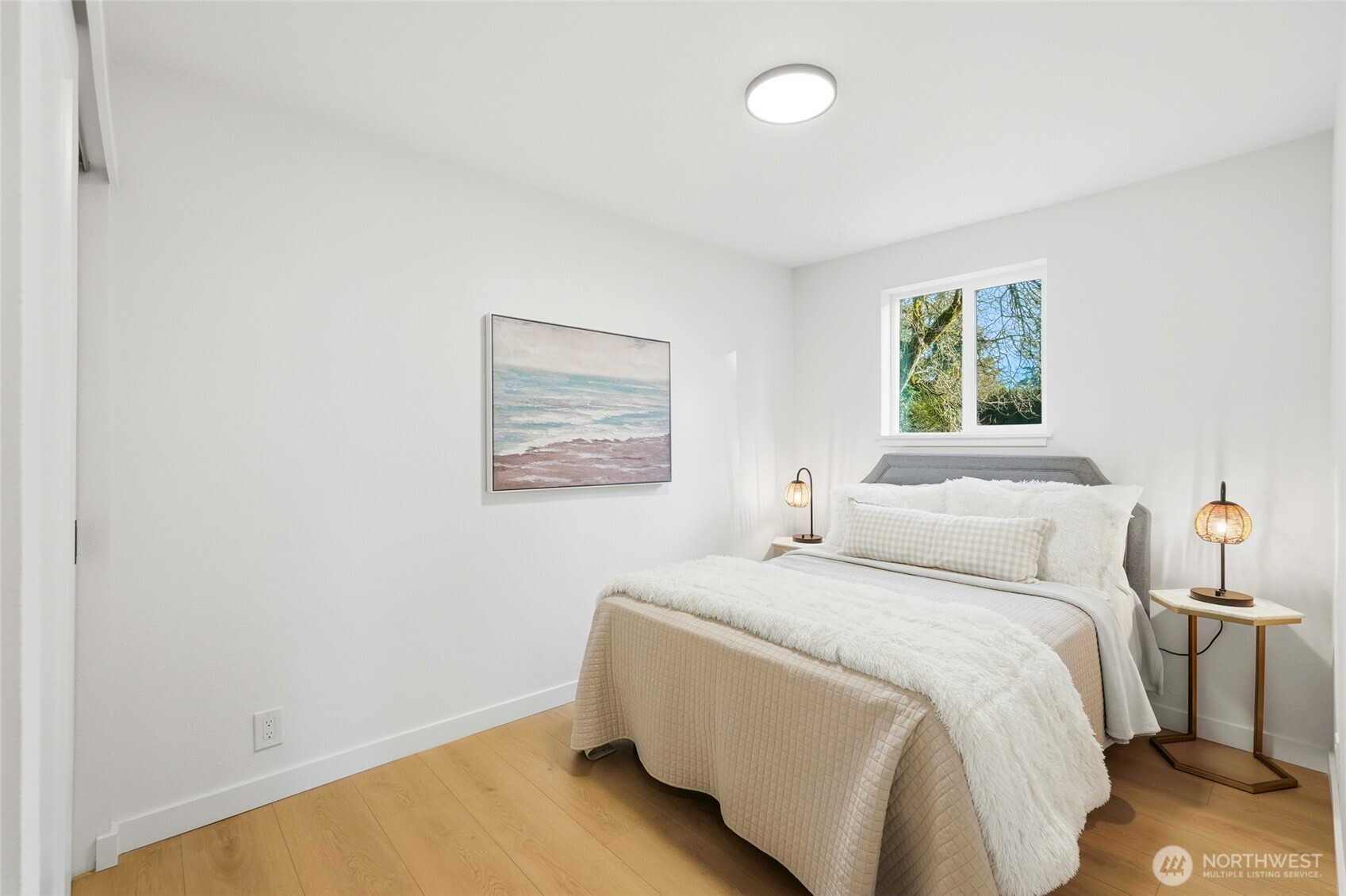 16126 Tiger Mountain Road Southeast Issaquah, WA 98027 - Photo 25 of 38 a bedroom with a bed and a window