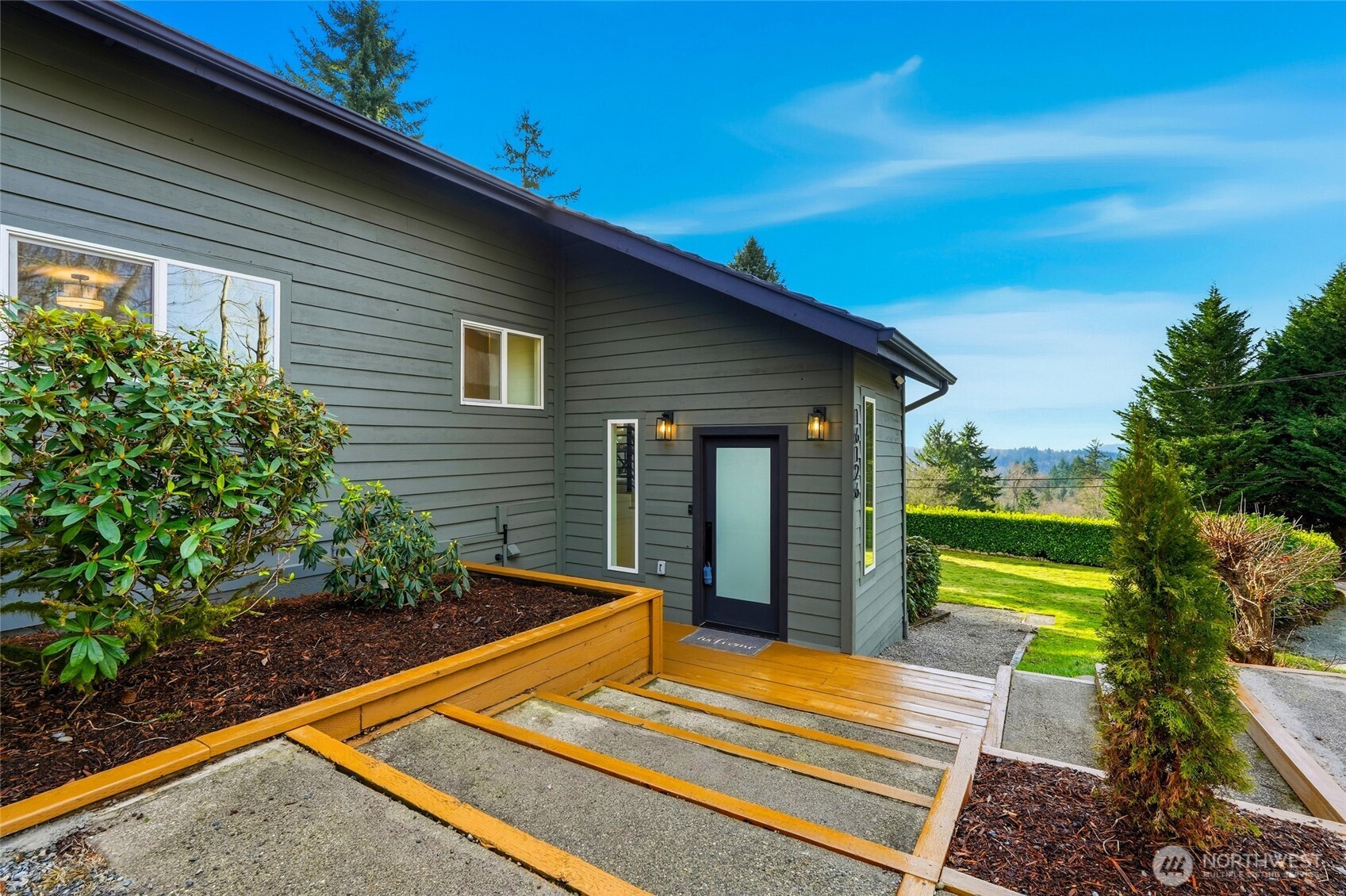 16126 Tiger Mountain Road Southeast Issaquah, WA 98027 - Photo 3 of 38 a view of a backyard with sitting area