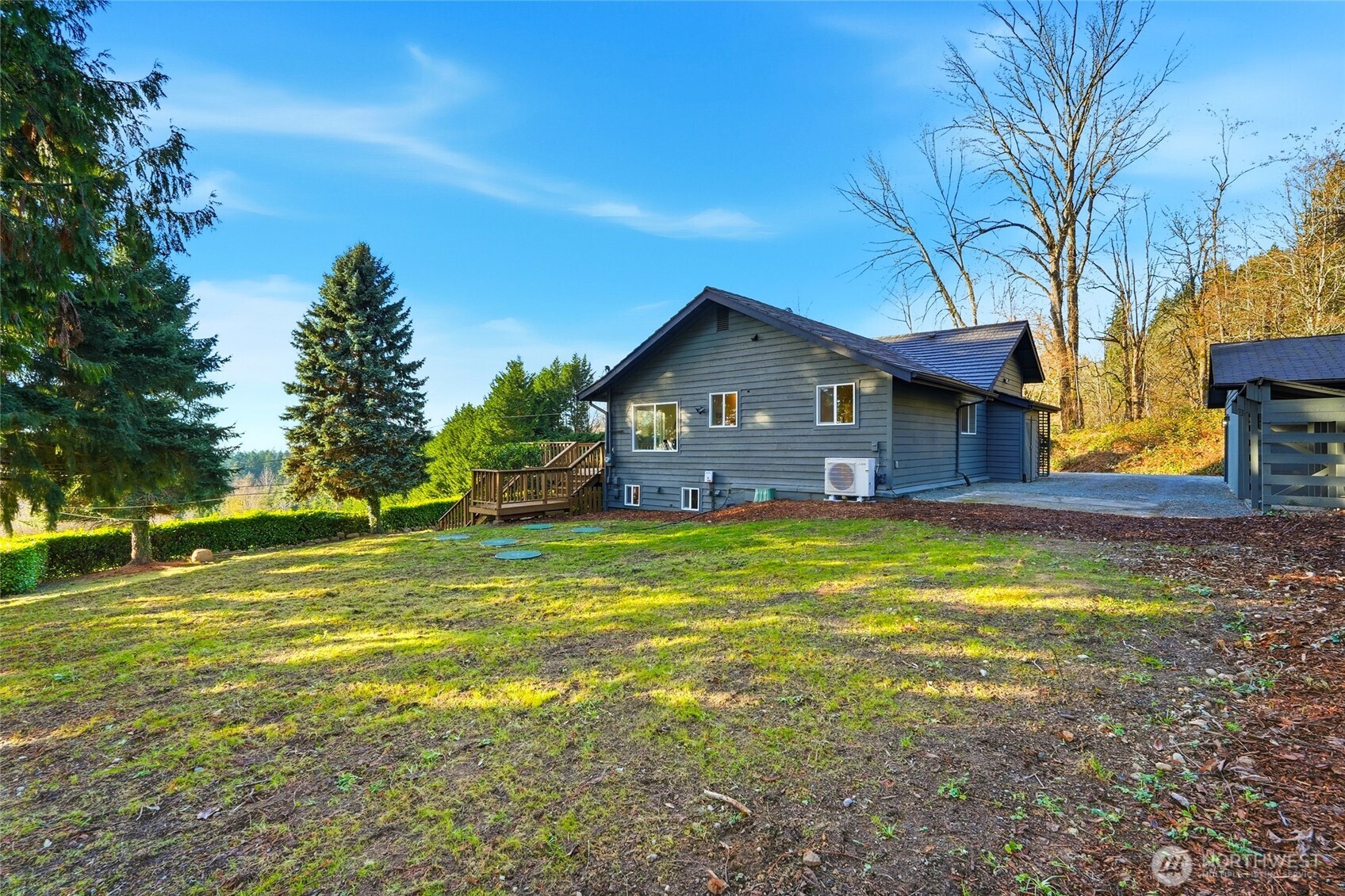 16126 Tiger Mountain Road Southeast Issaquah, WA 98027 - Photo 35 of 38 a front view of a house with a big yard
