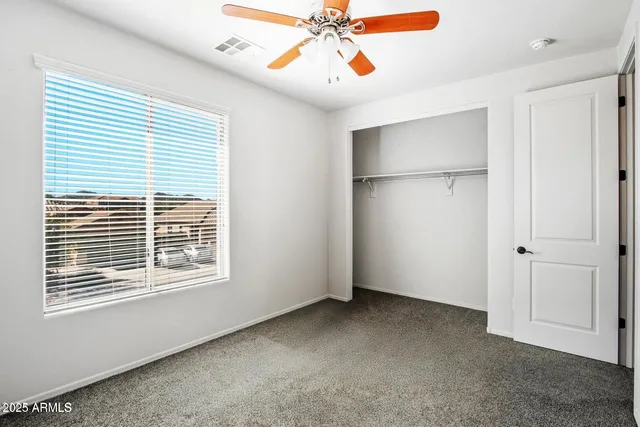 a bathroom with a double vanity sink toilet and shower