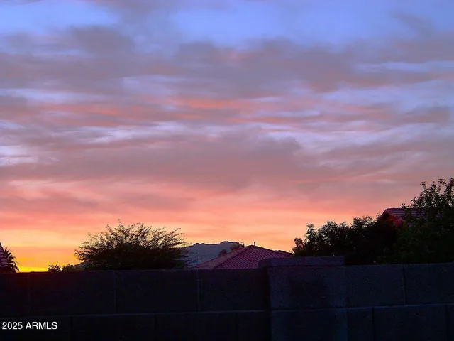 a view of a house with backyard porch and sitting area