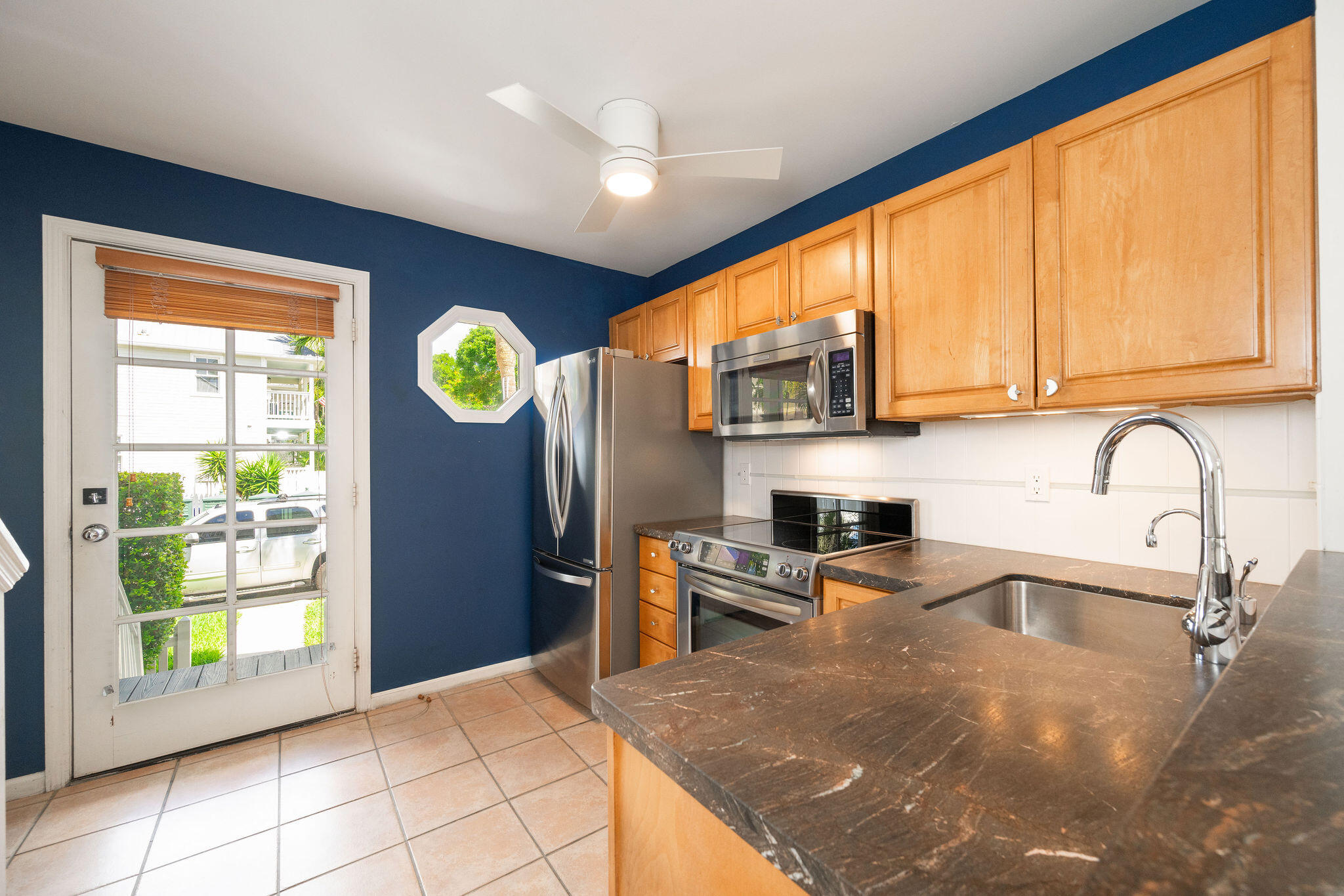 1 Spoonbill Way Key West, FL 33040 - Photo 13 of 38 a kitchen with stainless steel appliances granite countertop a refrigerator and a sink
