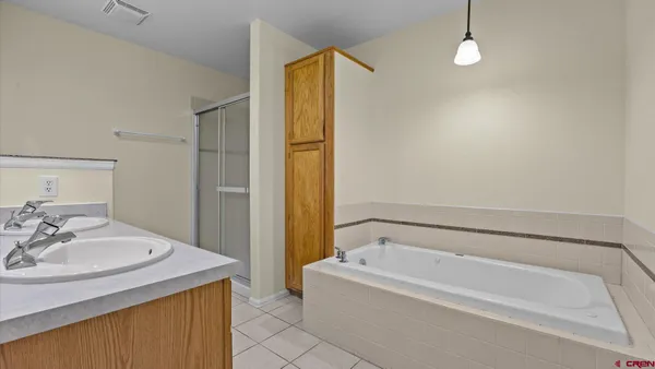 a bathroom with a bathtub and a sink