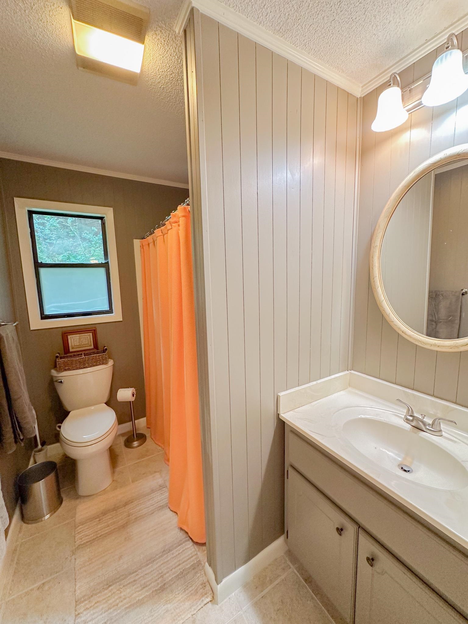 15 Cr 443 Road Iuka, MS 38852 - Photo 8 of 21 Bathroom featuring ornamental molding, vanity, toilet, and a textured ceiling