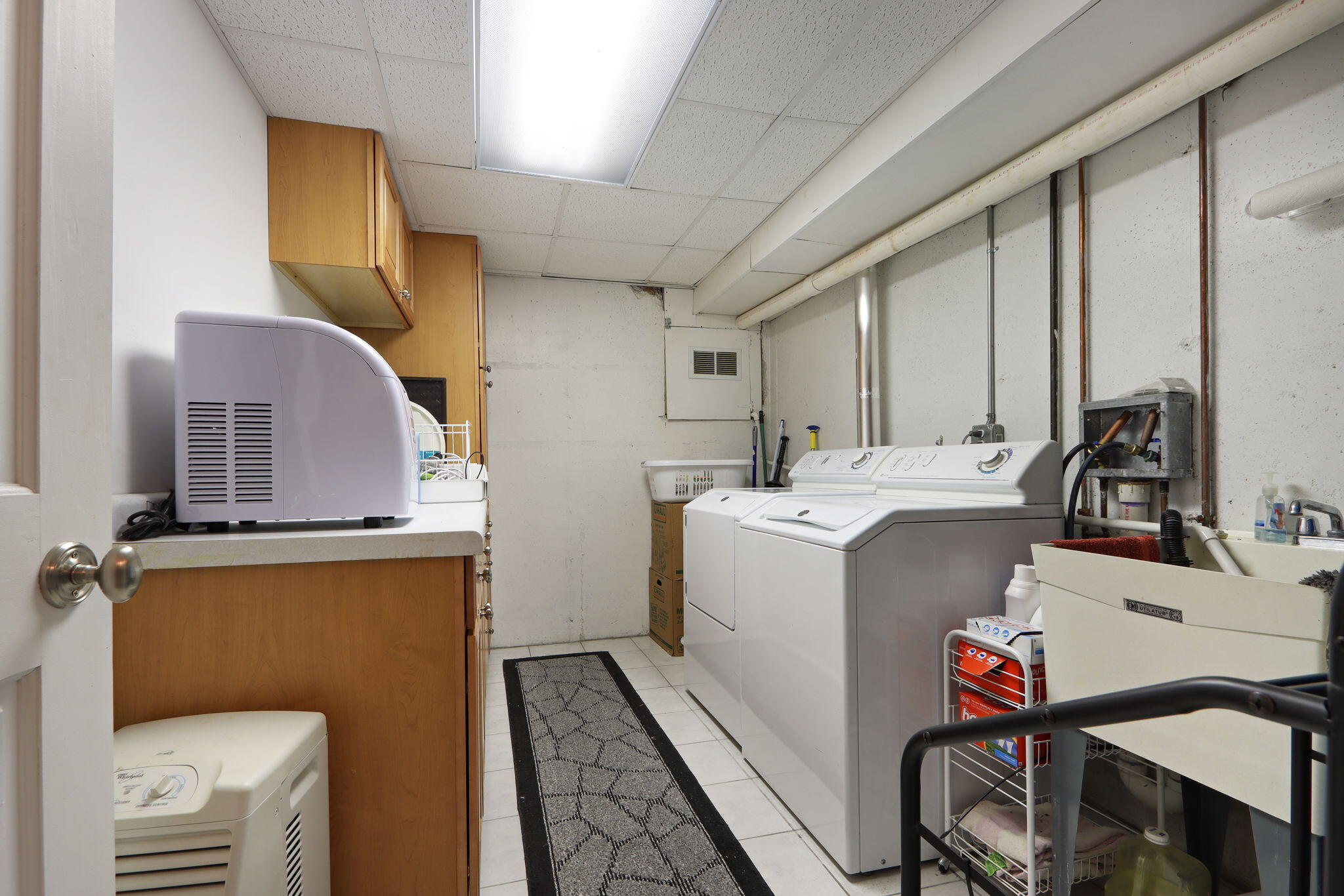 W5368 Plantation Road Sugar Creek, WI 53121 - Photo 25 of 31 Laundry Room with Custom Cabinets