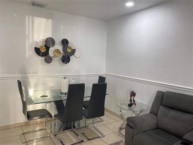 a view of kitchen with cabinets